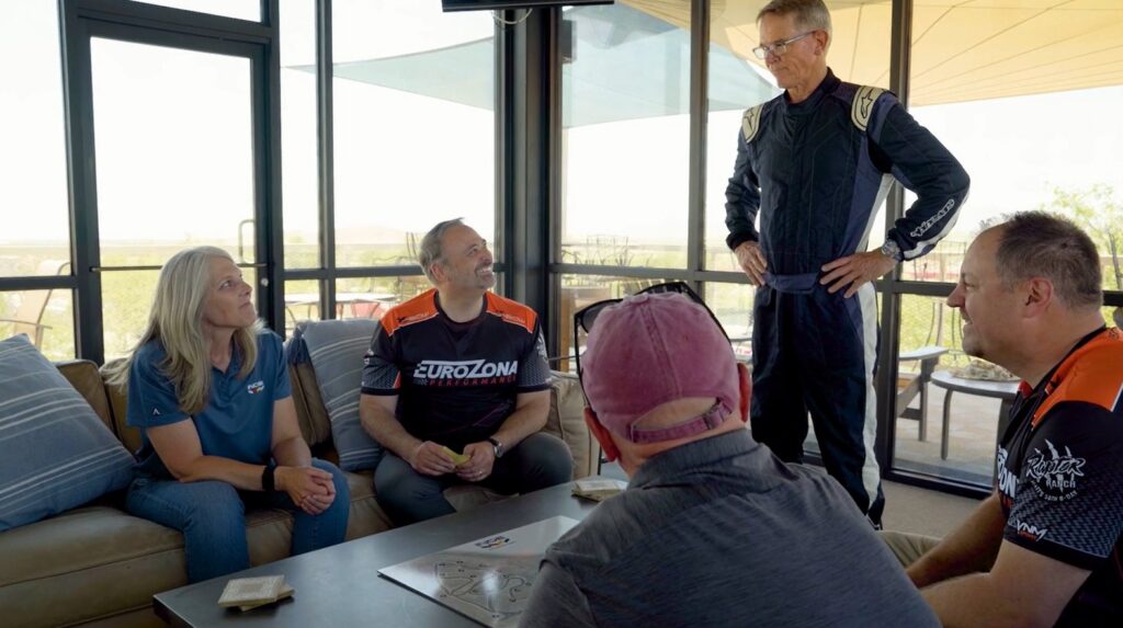 The Beat the Pro hosts, drivers and Randy Pobst in the clubhouse